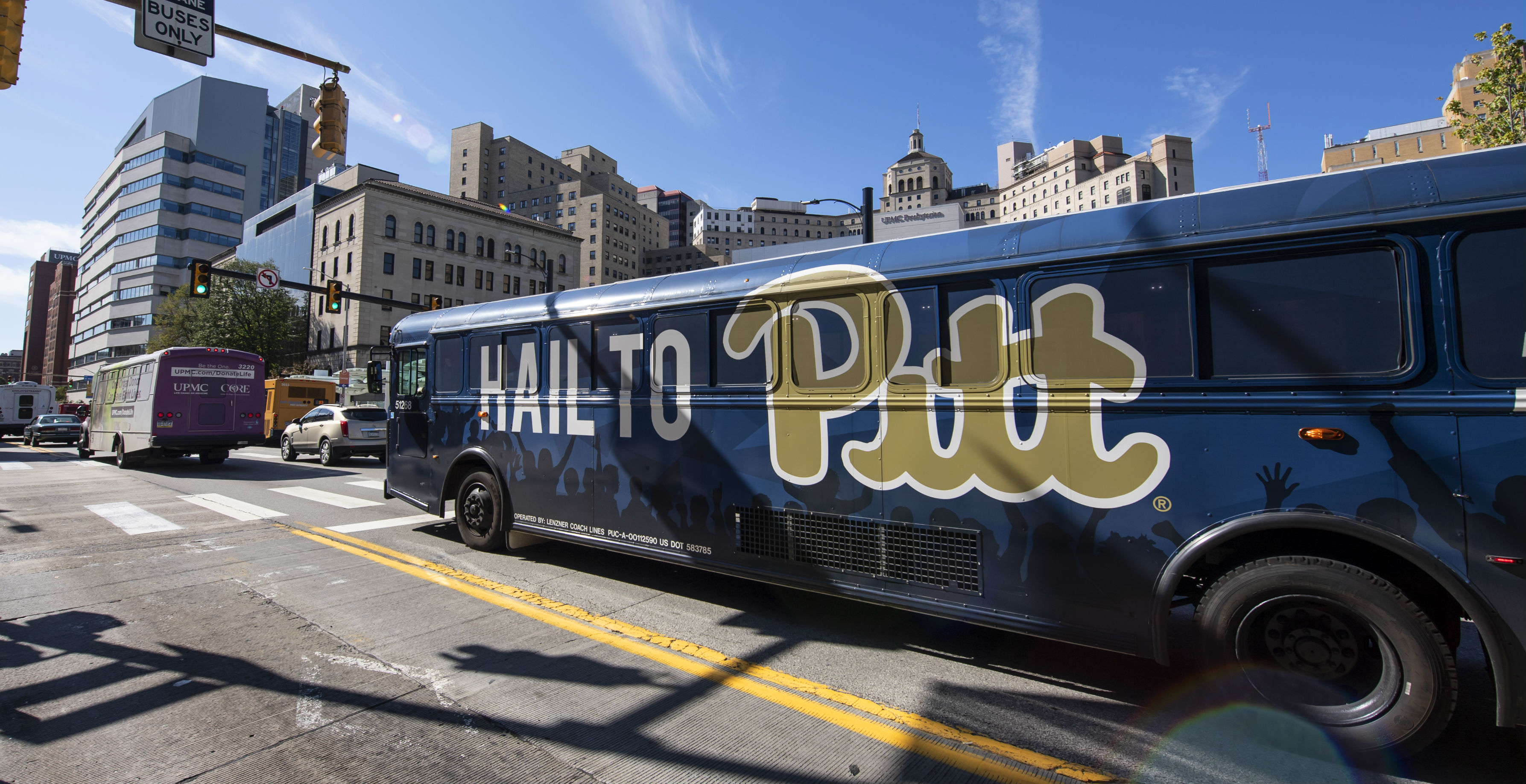 Image of a Pitt Shuttle on Fifth Avenue
